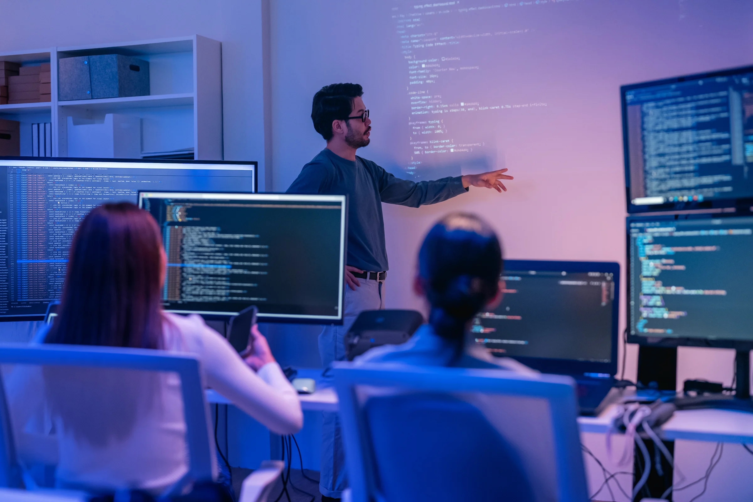 Technology team reviewing code in an office.