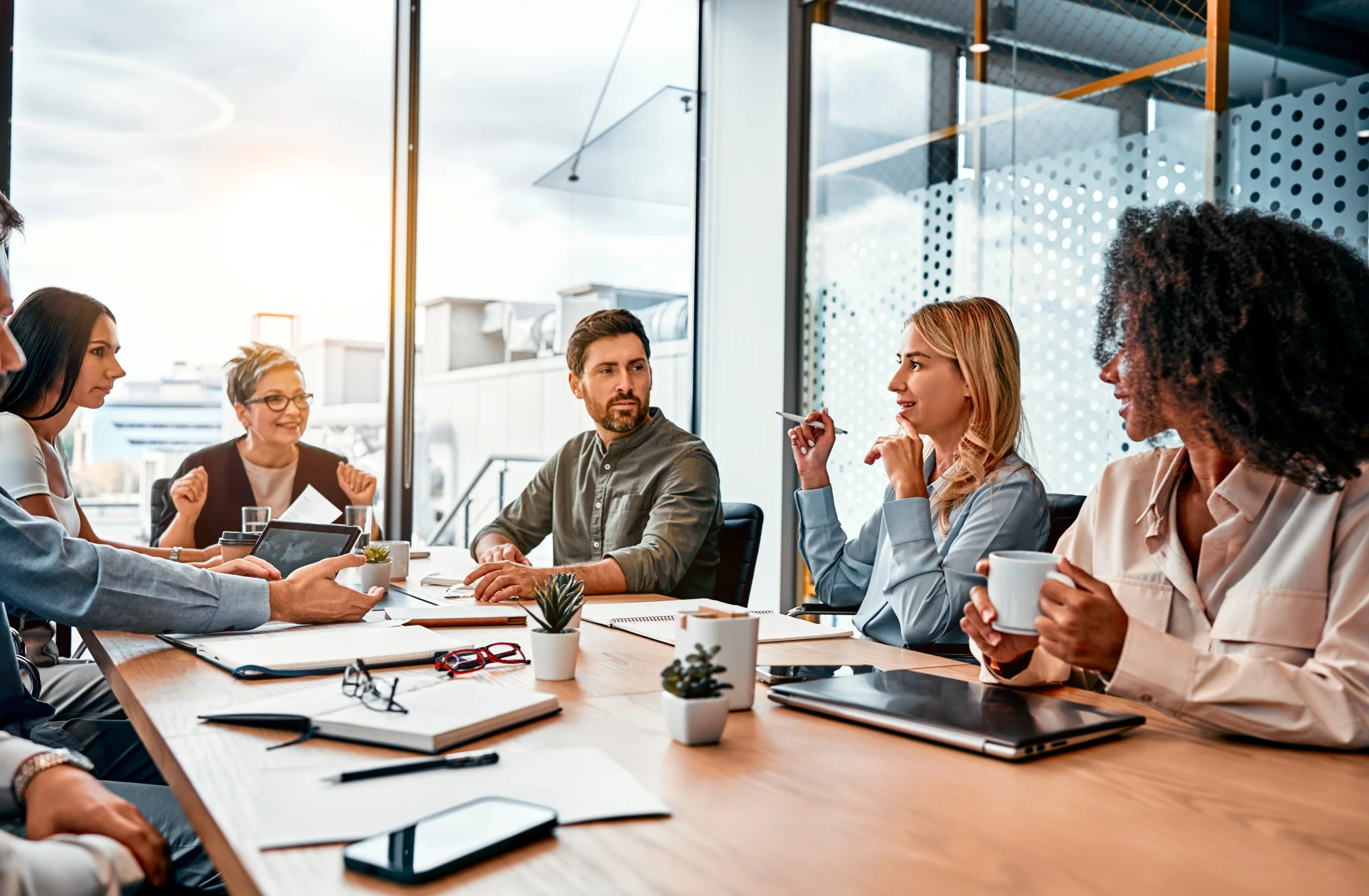 Business team meeting around a conference table.