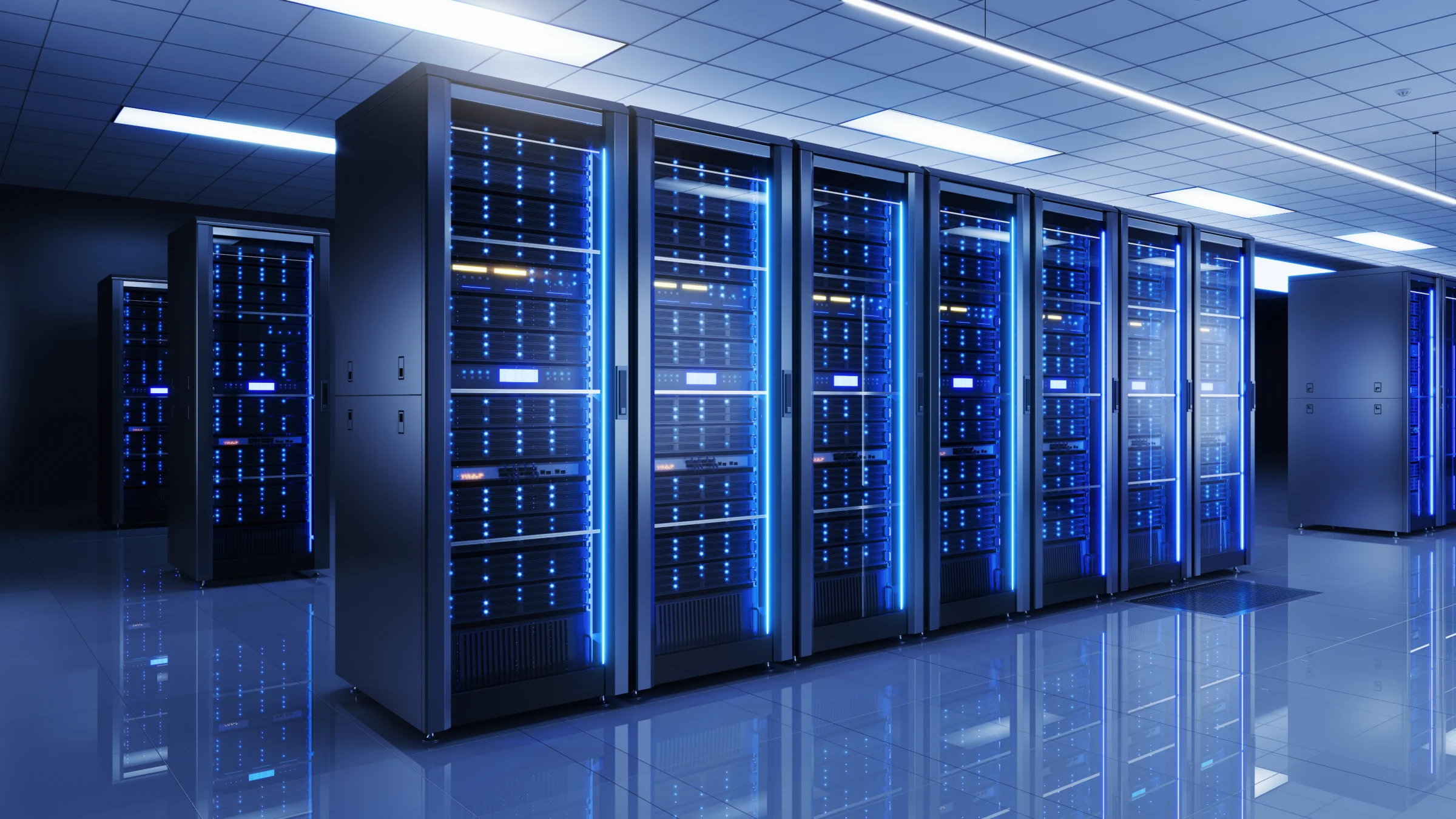 Rows of illuminated server racks in a data center.