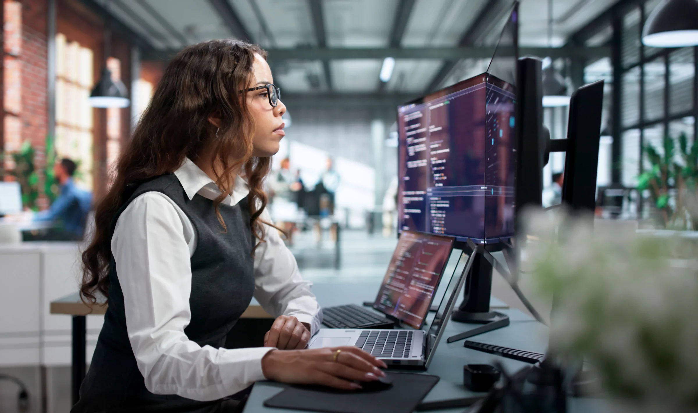 Professional working at a computer workstation.