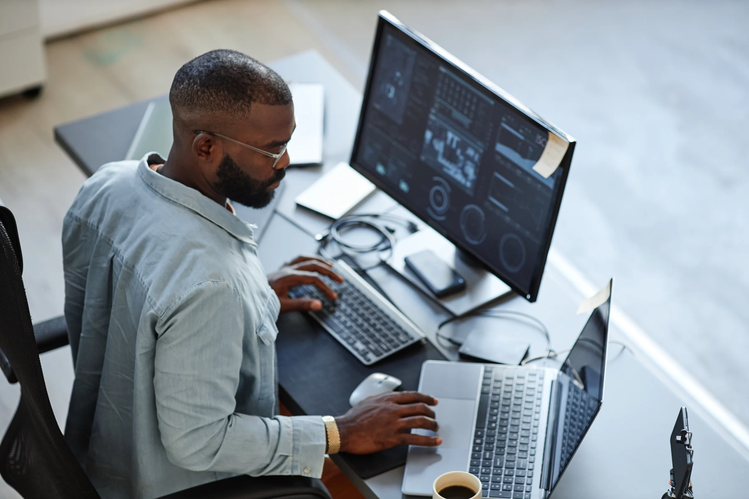 Technology professional monitoring computer systems.